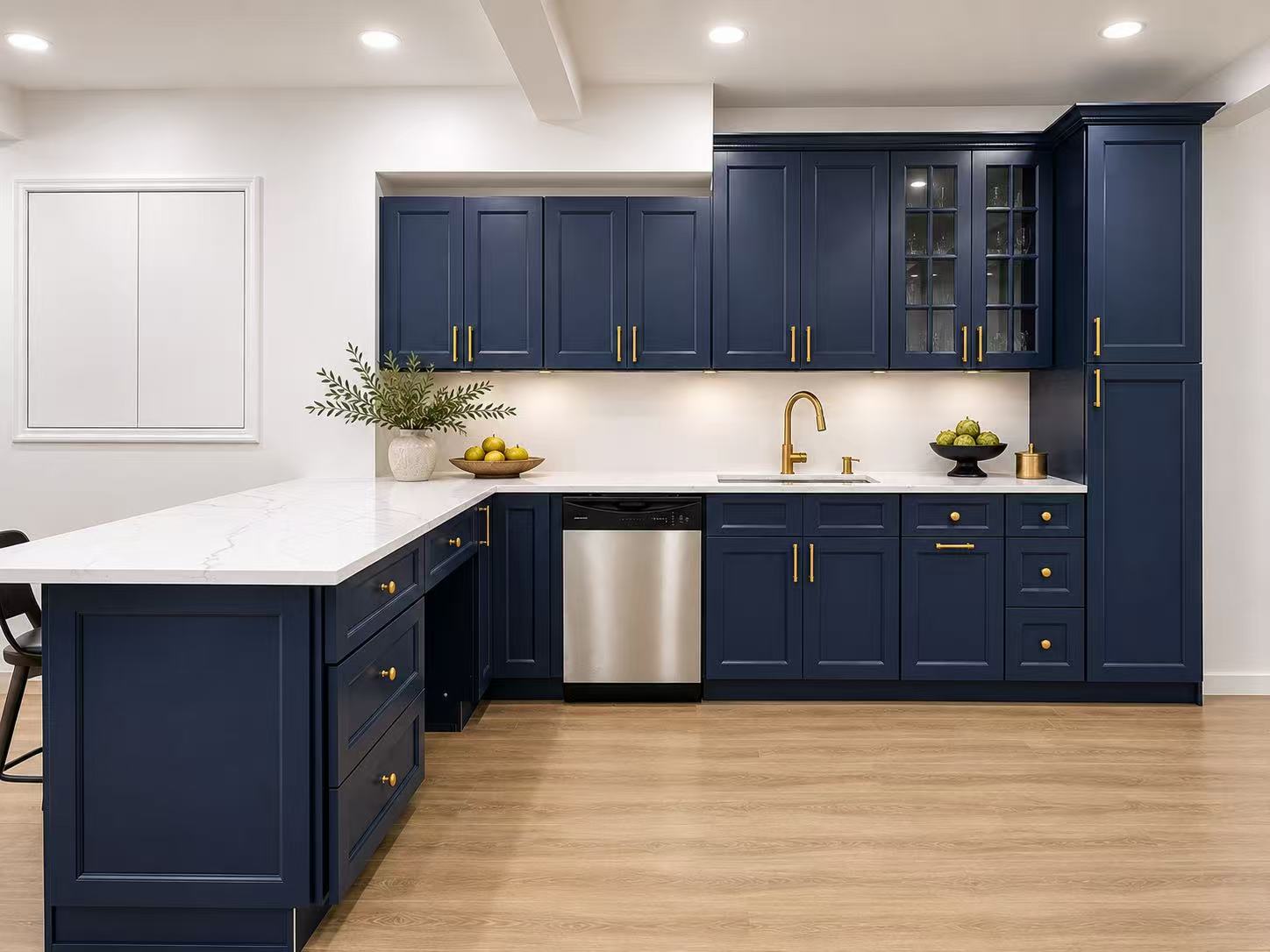 Navy blue kitchen cabinets with gold hardware