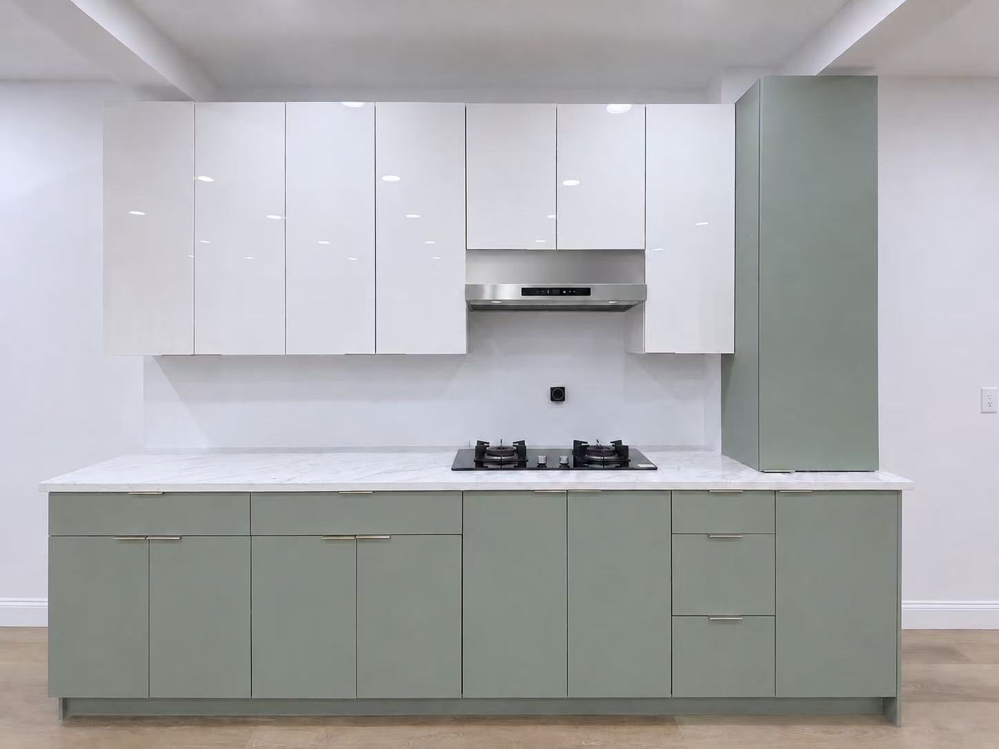 Mint green kitchen with white upper cabinets