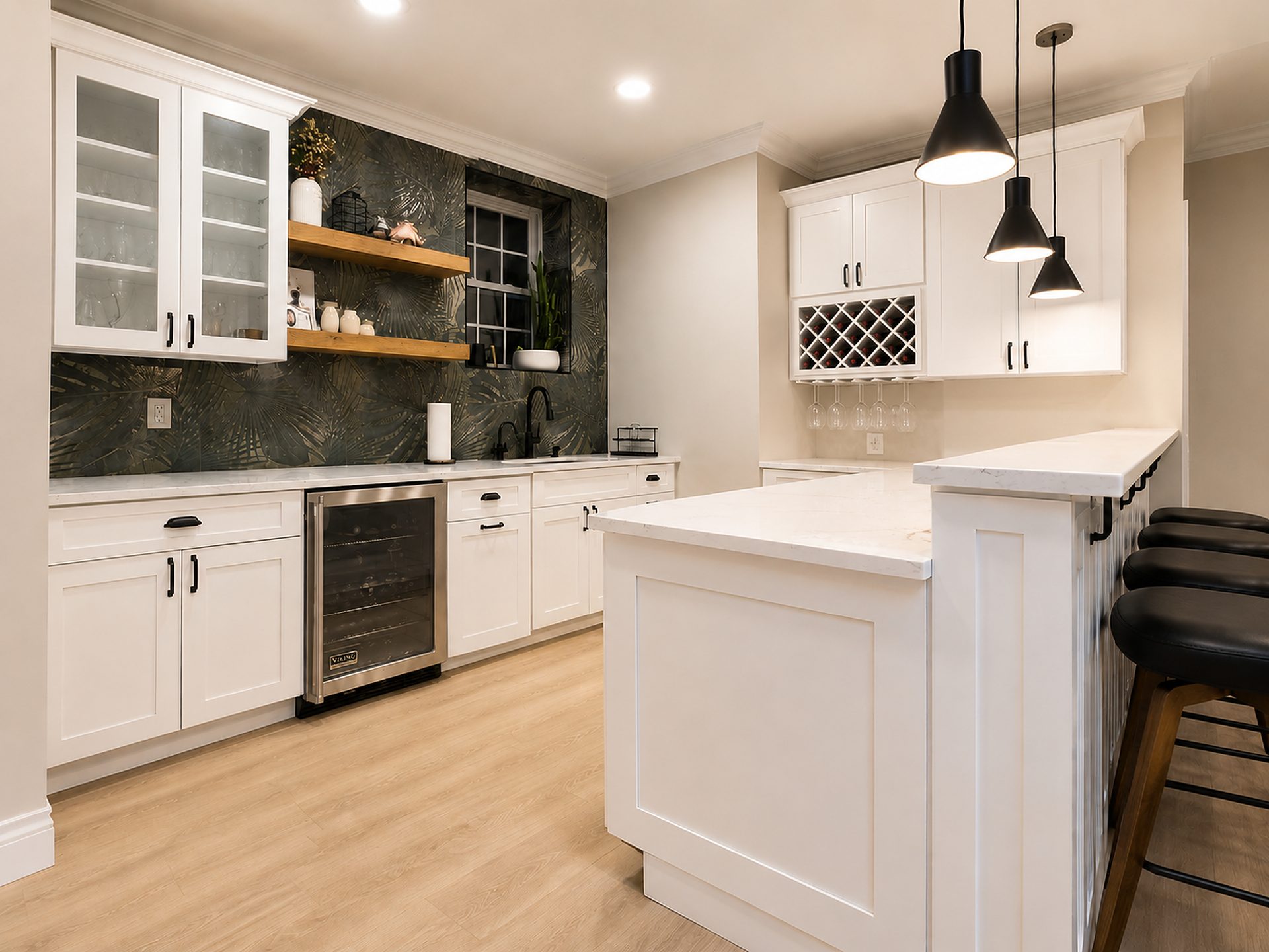 Two-tone white and black kitchen with bar area
